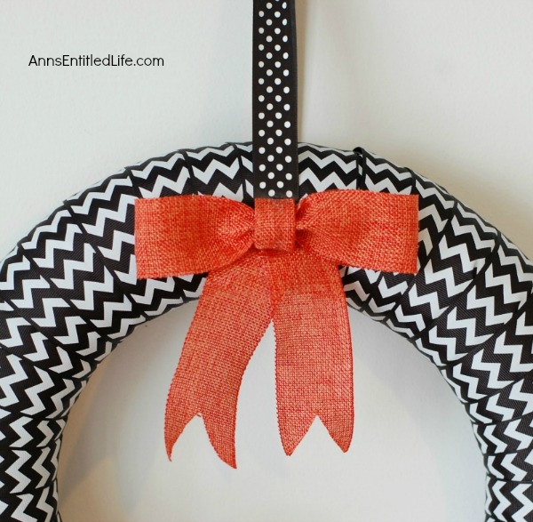 BOO-Tiful Halloween Wreath. While this beautiful DIY Halloween Wreath will not scare anyone, it is lovely and stylish Halloween decor. Hang this Halloween wreath on your front door, side door, over a mantel - anywhere you place seasonal wreath decor. These easy to follow step by step instruction tutorial will have you completing this BOO-Tiful Halloween Wreath in no time flat!