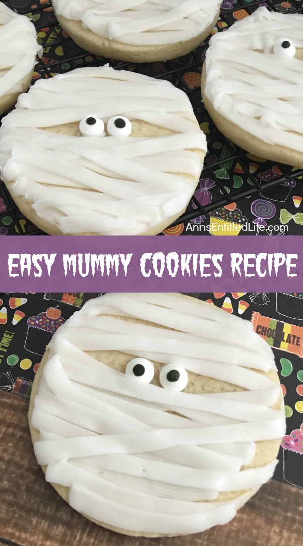 5 kid-frendly mummy decorated sugar cookies on a halloween background