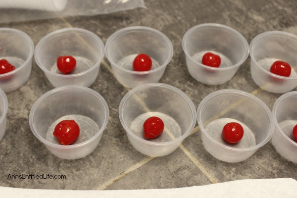Cherry Surprise Jello Shots Recipe. This delightful cherry almond jello shot offers a nice little surprise in the middle. Simple to make, these Cherry Surprise Jello Shots are great for parties, tailgating, and more!