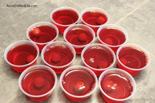 Cherry Surprise Jello Shots Recipe. This delightful cherry almond jello shot offers a nice little surprise in the middle. Simple to make, these Cherry Surprise Jello Shots are great for parties, tailgating, and more!