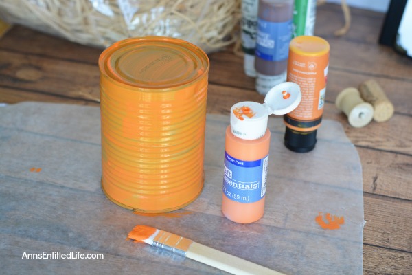 Tin Can Pumpkins Craft. A cute way to upcycle your soup, vegetable and fruit cans into a darling autumn craft. This Tin Can Pumpkins Craft is a variation of the tin can painting that we all learned in grade school. This is a simple craft that is easy enough for a child to make with some adult supervision.