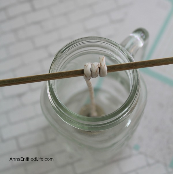 Homemade Mason Jar Soy Candle. Easily and inexpensively make your own Homemade Mason Jar Soy Candle! This is great for gifts or to scent your own home anytime of the year. Easily customize these candles to any color you like. This Homemade Mason Jar Soy Candle is a fun DIY project that yields great results!