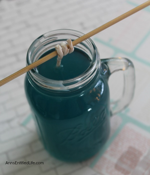 Homemade Mason Jar Soy Candle. Easily and inexpensively make your own Homemade Mason Jar Soy Candle! This is great for gifts or to scent your own home anytime of the year. Easily customize these candles to any color you like. This Homemade Mason Jar Soy Candle is a fun DIY project that yields great results!