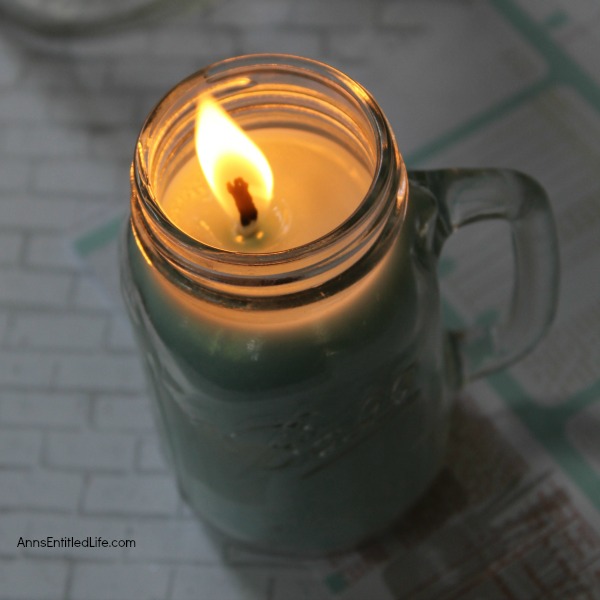 Homemade Mason Jar Soy Candle. Easily and inexpensively make your own Homemade Mason Jar Soy Candle! This is great for gifts or to scent your own home anytime of the year. Easily customize these candles to any color you like. This Homemade Mason Jar Soy Candle is a fun DIY project that yields great results!