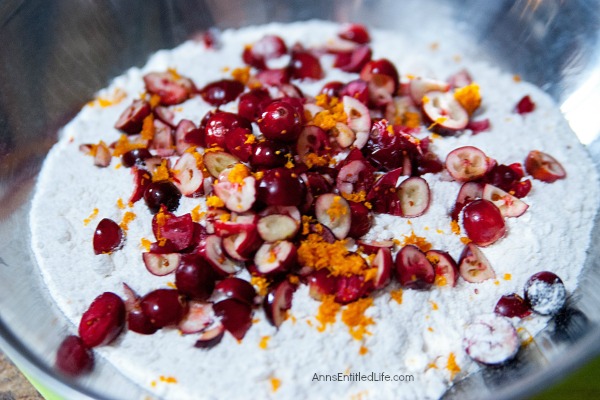 Mini Cranberry Orange Cake Recipe. This festive holiday dessert recipe is so easy to make! Only you will know the base is a boxed cake mix; your friends and family will marvel at your creativity while devouring these delicious Mini Cranberry Orange Cakes.