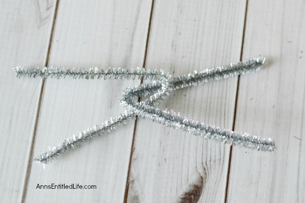Easy DIY Button Snowflake Ornament. An Easy DIY Button Snowflake Ornament craft anyone can make. This is a simple Christmas tree ornament to add to your handmade collection. 