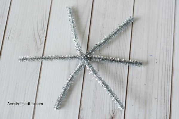 Easy DIY Button Snowflake Ornament. An Easy DIY Button Snowflake Ornament craft anyone can make. This is a simple Christmas tree ornament to add to your handmade collection. 