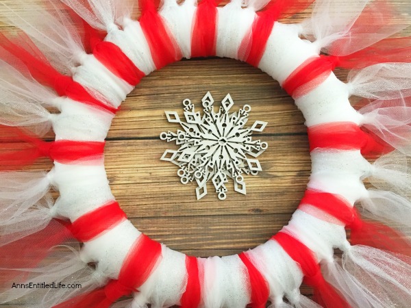 Easy Christmas Tulle Wreath. Update your holiday decor and make this Easy Christmas Tulle Wreath! Simple to make, this tulle wreath can be customized to any color to match your holiday decor.