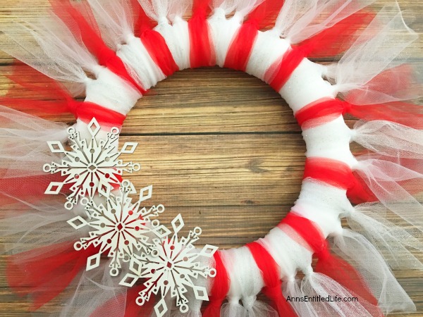 Easy Christmas Tulle Wreath. Update your holiday decor and make this Easy Christmas Tulle Wreath! Simple to make, this tulle wreath can be customized to any color to match your holiday decor.