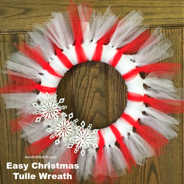 Easy Christmas Tulle Wreath. Update your holiday decor and make this Easy Christmas Tulle Wreath! Simple to make, this tulle wreath can be customized to any color to match your holiday decor.