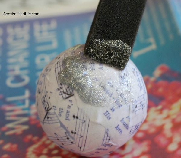 Joy Decoupage Christmas Ornament. Make your own decoupage Christmas Ornament. This easy step by step tutorial for a Joy Decoupage Christmas Ornament results in a beautiful handmade ornament that you can hang on your tree, or give as a gift. This DIY project is so easy, nearly anyone can do it!