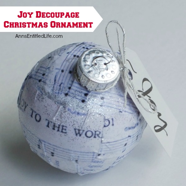 Joy Decoupage Christmas Ornament. Make your own decoupage Christmas Ornament. This easy step by step tutorial for a Joy Decoupage Christmas Ornament results in a beautiful handmade ornament that you can hang on your tree, or give as a gift. This DIY project is so easy, nearly anyone can do it!