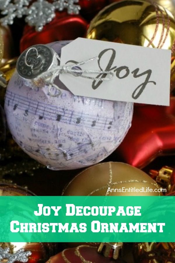 Joy Decoupage Christmas Ornament. Make your own decoupage Christmas Ornament. This easy step by step tutorial for a Joy Decoupage Christmas Ornament results in a beautiful handmade ornament that you can hang on your tree, or give as a gift. This DIY project is so easy, nearly anyone can do it!