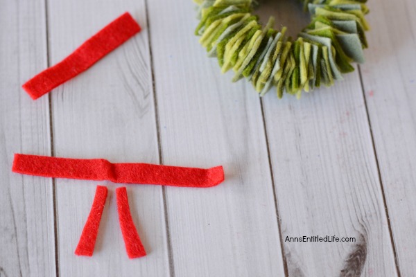 Felt Wreath Ornament Craft. Homemade Christmas ornaments are special crafts to keep, and to give. These easy Felt Wreath Ornaments are simply adorable! Older children, under adult supervision, can also make these felt wreaths using the step by step tutorial photographs and instructions as guidance.