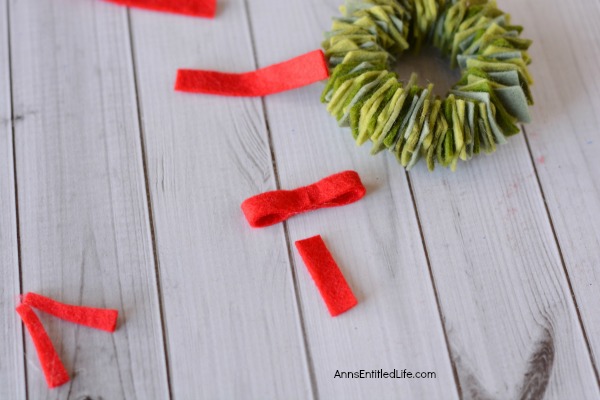 Felt Wreath Ornament Craft. Homemade Christmas ornaments are special crafts to keep, and to give. These easy Felt Wreath Ornaments are simply adorable! Older children, under adult supervision, can also make these felt wreaths using the step by step tutorial photographs and instructions as guidance.