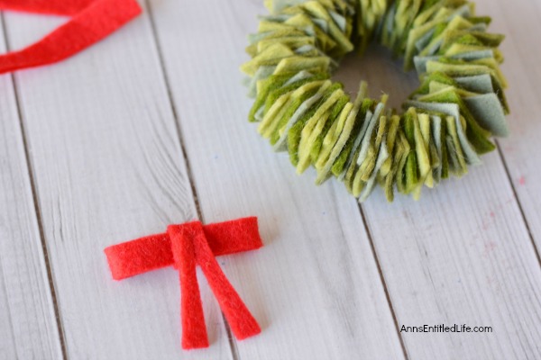 Felt Wreath Ornament Craft. Homemade Christmas ornaments are special crafts to keep, and to give. These easy Felt Wreath Ornaments are simply adorable! Older children, under adult supervision, can also make these felt wreaths using the step by step tutorial photographs and instructions as guidance.