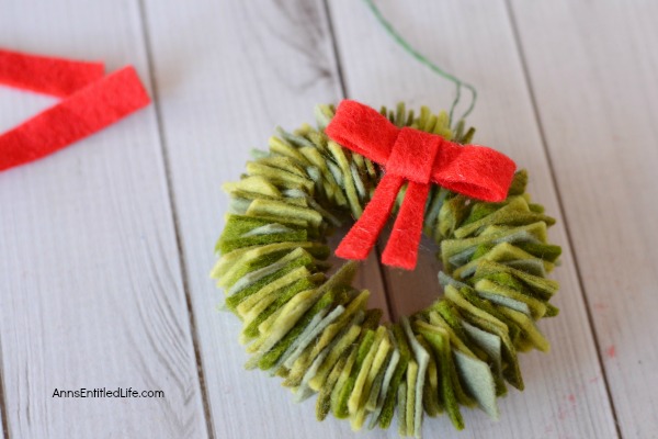 Felt Wreath Ornament Craft. Homemade Christmas ornaments are special crafts to keep, and to give. These easy Felt Wreath Ornaments are simply adorable! Older children, under adult supervision, can also make these felt wreaths using the step by step tutorial photographs and instructions as guidance.