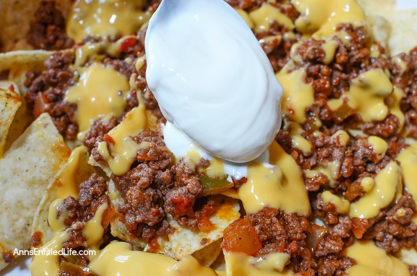 Nachos Deluxe. This fast and easy Nachos Deluxe recipe can be eaten as lunch or dinner, or served as a snack! Great for game day snacking, movie time, or anytime. This delicious treat is ready in under 20 minutes, and is oh so good!