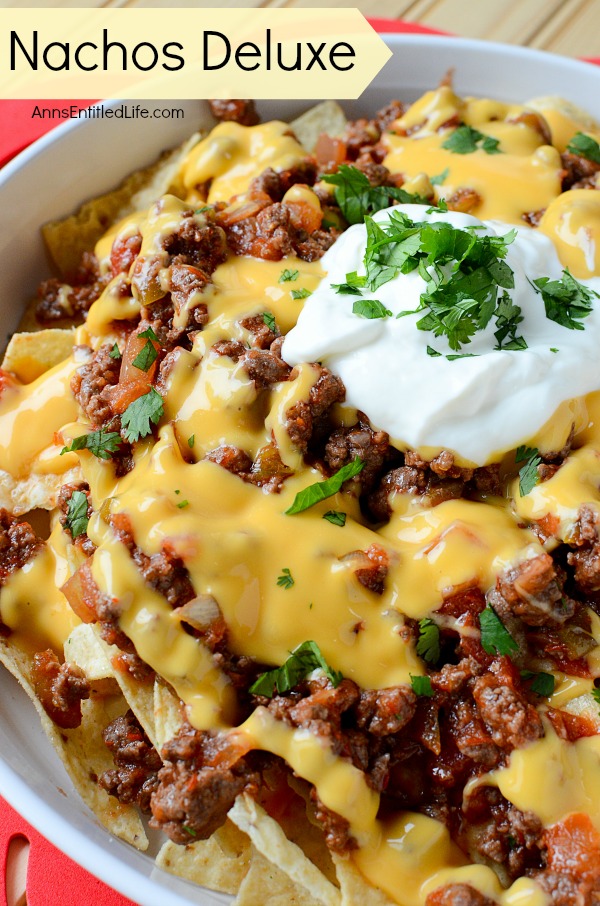 Nachos Deluxe. This fast and easy Nachos Deluxe recipe can be eaten as lunch or dinner, or served as a snack! Great for game day snacking, movie time, or anytime. This delicious treat is ready in under 20 minutes, and is oh so good!