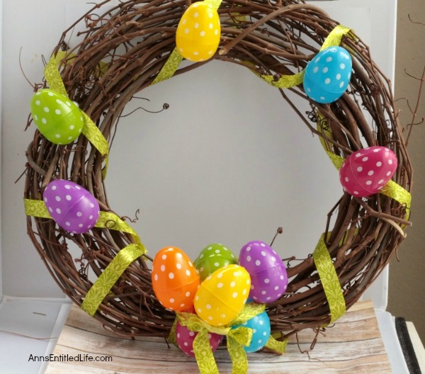 DIY Easter Egg Wreath. This Easter egg grapevine wreath is a wonderful spring door craft. This cute, simple to make, Easter egg wreath is an inexpensive Easter decoration, perfect decor for your door, over your fireplace or on a wall.