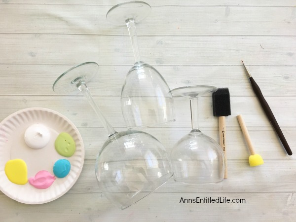 Easter Egg Wineglass DIY. Make your own adorable Easter egg wineglasses! This easy step by step tutorial will show you how to easily make sweet Easter egg wineglass decor which are perfect for a centerpiece, mantel decor or table decorations this Easter! This is an easy to make, delightful Easter season craft project.