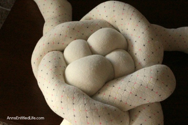 How to Make a Knot Pillow DIY Tutorial. You will not believe how simple it is to make this trendy pillow knot design. This knot pillow DIY version costs a whole lot less than a store bought pillow knot, and only takes about an hour to make.