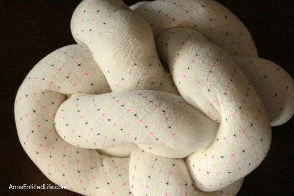 How to Make a Knot Pillow DIY Tutorial. You will not believe how simple it is to make this trendy pillow knot design. This knot pillow DIY version costs a whole lot less than a store bought pillow knot, and only takes about an hour to make.