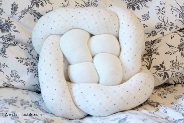 How to Make a Knot Pillow DIY Tutorial. You will not believe how simple it is to make this trendy pillow knot design. This knot pillow DIY version costs a whole lot less than a store bought pillow knot, and only takes about an hour to make.