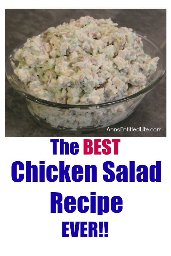 chicken salad in a glass serving bowl on top of a grey slate kitchen island