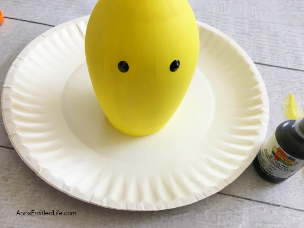 Yellow Chick Wineglass DIY. Make your own adorable Yellow Chick Wineglass. This easy step by step tutorial will show you how to easily make a sweet wineglass chickie which is perfect for a centerpiece, mantel decor or table decorations this Easter or spring! This is an easy to make, delightful spring craft project.