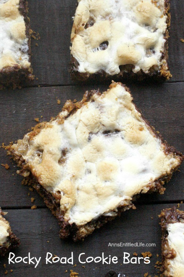 Rocky Road Cookie Bars Recipe. These rocky road cookie bars are made by placing layers of sweet goodness over a graham cracker crust base. These easy to make cookie bars taste a whole lot like rocky road candy! If you like road candy, you will love these melt in your mouth delicious Rocky Road Cookie Bars!