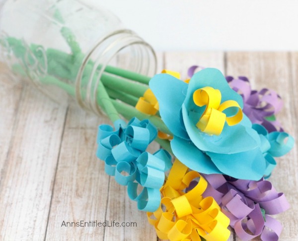 Handmade Paper Flower Bouquet. An easy step by step tutorial on how to make paper flowers at home. Learn to make a beautiful handmade paper flower bouquet today!