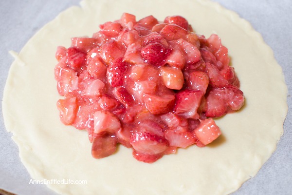 Strawberry Rhubarb Galette Recipe. Using fresh (or frozen) fruit, this pretty galette dessert is easy to make, but impressive to serve - not to mention super tasty! Make it for a treat tonight!