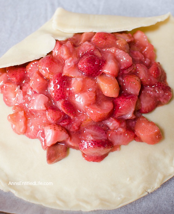 Strawberry Rhubarb Galette Recipe. Using fresh (or frozen) fruit, this pretty galette dessert is easy to make, but impressive to serve - not to mention super tasty! Make it for a treat tonight!