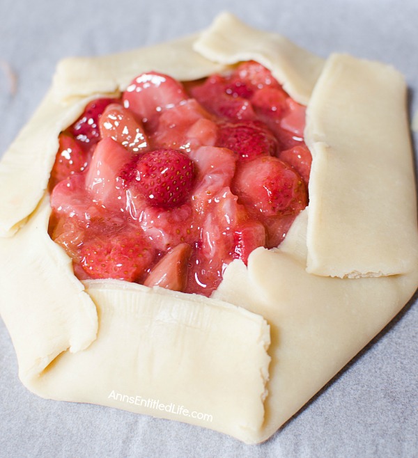 Strawberry Rhubarb Galette Recipe. Using fresh (or frozen) fruit, this pretty galette dessert is easy to make, but impressive to serve - not to mention super tasty! Make it for a treat tonight!