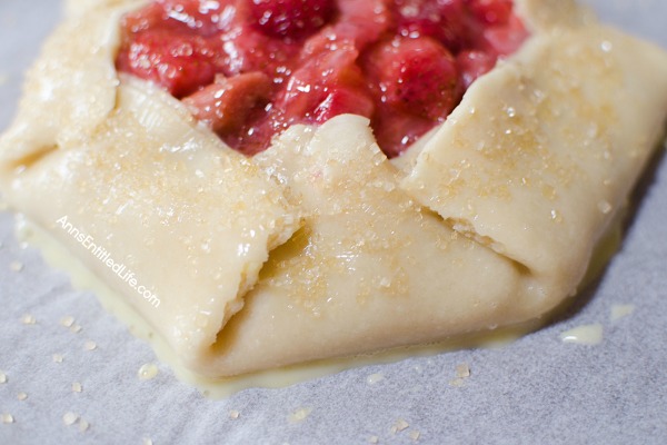 Strawberry Rhubarb Galette Recipe. Using fresh (or frozen) fruit, this pretty galette dessert is easy to make, but impressive to serve - not to mention super tasty! Make it for a treat tonight!