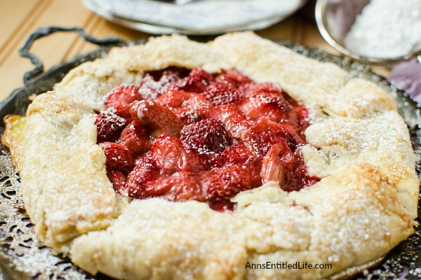 Strawberry Rhubarb Galette Recipe. Using fresh (or frozen) fruit, this pretty galette dessert is easy to make, but impressive to serve - not to mention super tasty! Make it for a treat tonight!