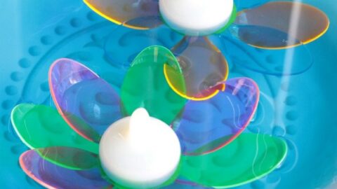 DIY Floating Spoon Flowers. Make your own floating flowers from plastic spoons! These simple to make floating flowers would be perfect to use at a wedding, summer party, in a backyard pool, or to light up in your backyard pond.