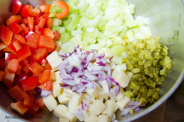 Herbed Cheese and Veggie Macaroni Salad Recipe. A new twist on an old favorite, this herbed cheese and vegetable recipe is simply delicious. An easy recipe to make, this summer side dish is a perfect accompaniment for backyard barbecues, picnics, lunches and evening meals.