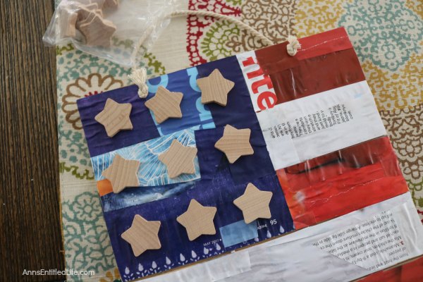 This DIY Decoupage American Flag Sign can be hung on your front door or inside your home or displayed on your patio for Independence Day - or anytime really since it is an 