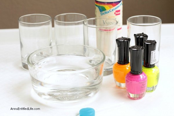Nail Polish Painted Glasses DIY. These nail polish painted glasses are fun and easy to make. Since they are so unique, they make the perfect talking piece or a wonderful gift! Make a set and pair with a bottle of wine or liquor to give as a special birthday present, shower gift or housewarming gift! These interesting nail polish designs will be a popular gift with everyone.