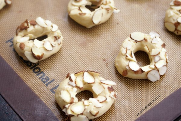 Almond Doughnut Cookies Recipe. Fun, easy to make cookies in the shape of a doughnut! These cookies are wonderful for packing in the old lunchbox, dessert or a cookie exchange!
