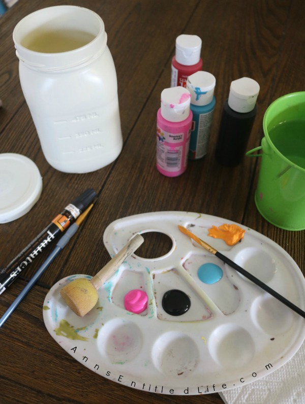 Sugar Skull Mason Jar Craft. This easy to make sugar skull is fashioned from an old Mason jar.  You can store kitchen utensils, candy (keep the lid!), etc in these jar for Halloween or to celebrate the Day of the Dead. Using old glass jars is a great way to get crafty at home and make your own cute décor at the same time.