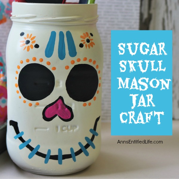 Sugar Skull Mason Jar Craft. This easy to make sugar skull is fashioned from an old Mason jar.  You can store kitchen utensils, candy (keep the lid!), etc in these jar for Halloween or to celebrate the Day of the Dead. Using old glass jars is a great way to get crafty at home and make your own cute décor at the same time.