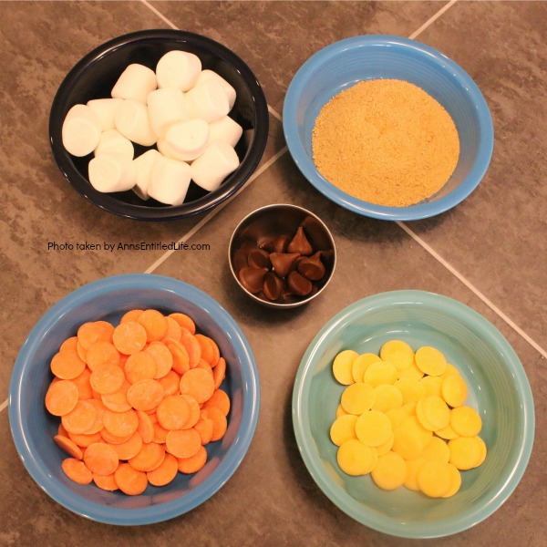 Easy Candy Corn S'mores Recipe. These are one of the easiest treats you can make. You do not need a campfire to get the great taste of S'mores. Make these delicious candy corn S'mores in your kitchen in about 10 minutes. Great for parties and snacks, these cute little candy corn s'mores are a simple sweet treat adults and children will love!