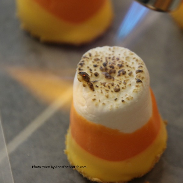 Easy Candy Corn S'mores Recipe. These are one of the easiest treats you can make. You do not need a campfire to get the great taste of S'mores. Make these delicious candy corn S'mores in your kitchen in about 10 minutes. Great for parties and snacks, these cute little candy corn s'mores are a simple sweet treat adults and children will love!