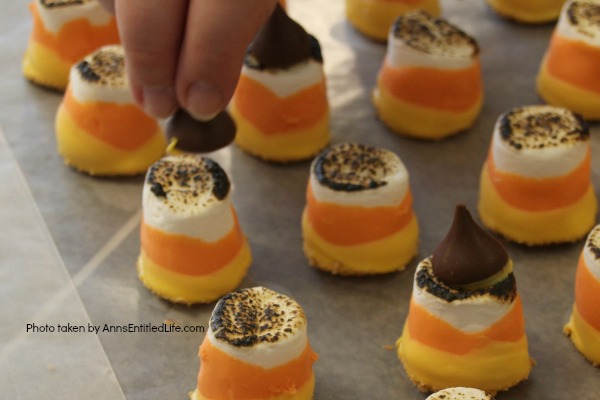 Easy Candy Corn S'mores Recipe. These are one of the easiest treats you can make. You do not need a campfire to get the great taste of S'mores. Make these delicious candy corn S'mores in your kitchen in about 10 minutes. Great for parties and snacks, these cute little candy corn s'mores are a simple sweet treat adults and children will love!