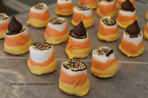 Easy Candy Corn S'mores Recipe. These are one of the easiest treats you can make. You do not need a campfire to get the great taste of S'mores. Make these delicious candy corn S'mores in your kitchen in about 10 minutes. Great for parties and snacks, these cute little candy corn s'mores are a simple sweet treat adults and children will love!