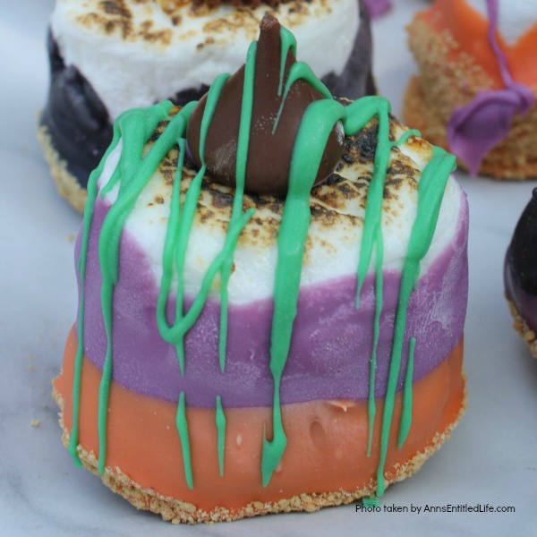 Easy Halloween S'mores Recipe. You do not need a campfire to get the great taste of S'mores. Make these delicious Halloween S'mores in your kitchen in about 10 minutes. Great for parties and snacks, these cute little Halloween s'mores are a simple sweet treat adults and children will love!