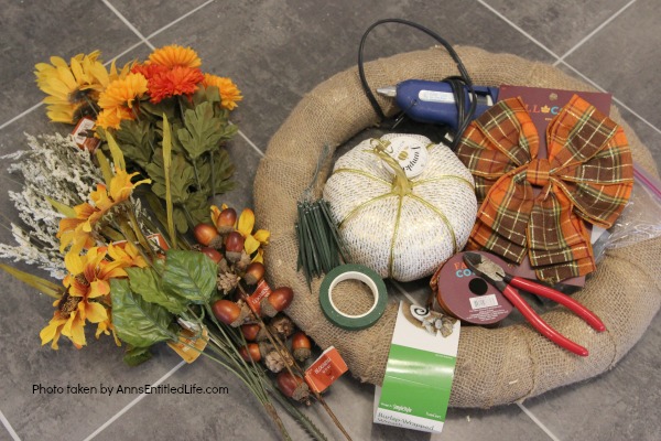 Rustic Fall Burlap Wreath DIY. This DIY tutorial on how to make a Rustic Fall Burlap Wreath has easy to follow, step-by-step instructions. Less than an hour or so of your time results in a lovely autumn wreath that is highly customizable, and a lot less expensive than a store bought wreath! Perfect fall decor for your front door.